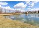 Scenic backyard pond provides relaxing water views and recreational activities at 8417 Southern Springs Way, Indianapolis, IN 46237