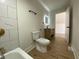 Bathroom featuring a vanity with modern fixtures and tiled shower at 1011 W 28Th St, Indianapolis, IN 46208