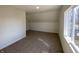 Cozy bedroom featuring plush carpeting and a window for natural light at 1011 W 28Th St, Indianapolis, IN 46208