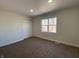 Cozy carpeted bedroom with natural light and a closet at 1011 W 28Th St, Indianapolis, IN 46208