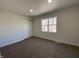 Carpeted bedroom with bright light and a double door closet at 1011 W 28Th St, Indianapolis, IN 46208