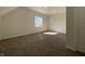 Bright bedroom with carpeting, window, and closet at 1011 W 28Th St, Indianapolis, IN 46208