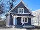 Charming home with a blue door and a cozy front porch at 1011 W 28Th St, Indianapolis, IN 46208
