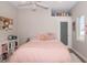 Cozy bedroom featuring a pink bed, plush pillows, and stylish decor at 1014 Jackson St, Columbus, IN 47201