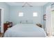 Bright blue bedroom with decorative storage and a balcony at 1014 Jackson St, Columbus, IN 47201