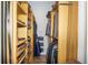 Spacious walk-in closet with custom wood shelving and woven storage baskets at 1014 Jackson St, Columbus, IN 47201