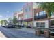 Contemporary three-story townhouse with neutral siding, a covered entrance, and a rooftop terrace at 1014 Jackson St, Columbus, IN 47201