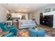 Open-concept living area with views to the kitchen, recessed lighting, and a large colorful rug at 1014 Jackson St, Columbus, IN 47201