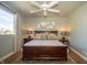 Bright main bedroom features a large window, ceiling fan and decorative rug and lighting at 1014 Jackson St, Columbus, IN 47201