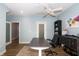 Inviting home office space with a modern ceiling fan, a spacious desk, and stylish decor at 1014 Jackson St, Columbus, IN 47201