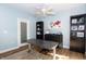 Serene home office with a ceiling fan, decorative world map, stylish furnishings, and a modern workspace at 1014 Jackson St, Columbus, IN 47201