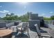 Rooftop deck with seating, table and grill at 1014 Jackson St, Columbus, IN 47201