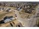 This aerial view highlights a residential community and surrounding landscape at 1033 Fuller Ln, Shelbyville, IN 46176
