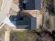 An overhead view of the home showing the roofline, driveway and landscaping at 1033 Fuller Ln, Shelbyville, IN 46176