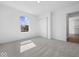 Well-lit bedroom with carpet flooring, closet, window, and neutral walls at 1033 Fuller Ln, Shelbyville, IN 46176