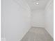 Walk-in closet with built-in wire shelving provides storage and organization at 1033 Fuller Ln, Shelbyville, IN 46176