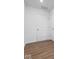 Hallway featuring wood-look flooring and white doors, creating a clean and modern feel at 1033 Fuller Ln, Shelbyville, IN 46176