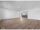 Bright open living space with modern flooring leading into the kitchen at 1033 Fuller Ln, Shelbyville, IN 46176