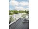 A charming balcony features a rocking chair and scenic neighborhood views at 12145 Bubbling Brook Dr # 600, Fishers, IN 46038