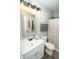 Well-lit bathroom featuring modern vanity with black faucet and stylish mirror, plus a tub and shower at 12145 Bubbling Brook Dr # 600, Fishers, IN 46038