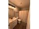 Cozy bathroom with a vanity, framed mirror, toilet, and bathtub with a neutral shower curtain at 12145 Bubbling Brook Dr # 600, Fishers, IN 46038
