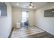 Comfortable home office has a ceiling fan and carpet at 12145 Bubbling Brook Dr # 600, Fishers, IN 46038