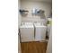 Functional laundry room with washer, dryer, and shelving at 12145 Bubbling Brook Dr # 600, Fishers, IN 46038
