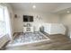 Inviting living area features a wall-mounted TV and a cozy rug at 12145 Bubbling Brook Dr # 600, Fishers, IN 46038