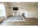 Inviting living area features a wall-mounted TV and a cozy rug at 12145 Bubbling Brook Dr # 600, Fishers, IN 46038