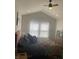 Serene main bedroom with vaulted ceiling, a large window, and comfortable furnishings at 12145 Bubbling Brook Dr # 600, Fishers, IN 46038