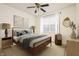 Cozy bedroom featuring a wood bed frame, neutral tones, and stylish decor at 12512 Geist Cove Dr, Indianapolis, IN 46236