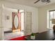 Open entryway featuring a decorative glass front door, tile flooring, and French doors at 12512 Geist Cove Dr, Indianapolis, IN 46236