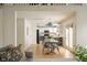 Open-concept kitchen and dining area featuring a stylish table, pendant lighting, and hardwood floors at 12512 Geist Cove Dr, Indianapolis, IN 46236