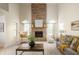 Elegant living room with a brick fireplace, vaulted ceilings, and lots of natural light at 12512 Geist Cove Dr, Indianapolis, IN 46236