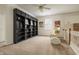 Upstairs living area with built-in shelving, a cozy chair, and a neutral color palette at 12512 Geist Cove Dr, Indianapolis, IN 46236
