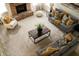 Spacious living room with a soaring fireplace, comfortable couches, and stylish coffee table at 12512 Geist Cove Dr, Indianapolis, IN 46236
