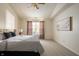 Comfortable main bedroom with large window, carpet, and a large bed with side tables at 12512 Geist Cove Dr, Indianapolis, IN 46236