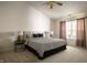 Spacious main bedroom featuring a large bed, side tables, and a bright window at 12512 Geist Cove Dr, Indianapolis, IN 46236