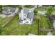 Aerial view of the property showcasing spacious backyard with patio and firepit with surrounding greenery at 12612 Clearview Ln, Indianapolis, IN 46236