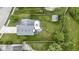 Bird's-eye view of the property showcases house, backyard with patio, and surrounding greenery at 12612 Clearview Ln, Indianapolis, IN 46236
