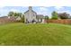 This backyard features a lush lawn with a patio, ideal for outdoor living and entertainment at 12612 Clearview Ln, Indianapolis, IN 46236