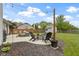 This backyard patio features a cozy firepit and stylish seating area, perfect for gatherings at 12612 Clearview Ln, Indianapolis, IN 46236