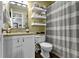 Clean bathroom featuring a shower/tub combo, white cabinets, and granite countertops at 12612 Clearview Ln, Indianapolis, IN 46236