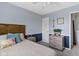 This bedroom boasts a wooden headboard, light blue walls, and modern, gray furniture at 12612 Clearview Ln, Indianapolis, IN 46236