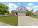 Charming two-story home with a well-manicured lawn and inviting curb appeal at 12612 Clearview Ln, Indianapolis, IN 46236