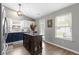 Charming kitchen featuring an island, two-tone cabinets, and stainless steel appliances at 12612 Clearview Ln, Indianapolis, IN 46236