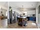 Bright kitchen with a central island, stainless steel refrigerator, and stylish pendant lighting at 12612 Clearview Ln, Indianapolis, IN 46236