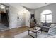 Cozy living room with vaulted ceilings, a large window, and modern decor at 12612 Clearview Ln, Indianapolis, IN 46236