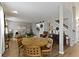 Open-concept living area with a round dining table, neutral tones, and cohesive decor at 12612 Clearview Ln, Indianapolis, IN 46236