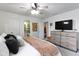 Spacious main bedroom with ceiling fan, an ensuite bathroom, and lots of closet space at 12612 Clearview Ln, Indianapolis, IN 46236